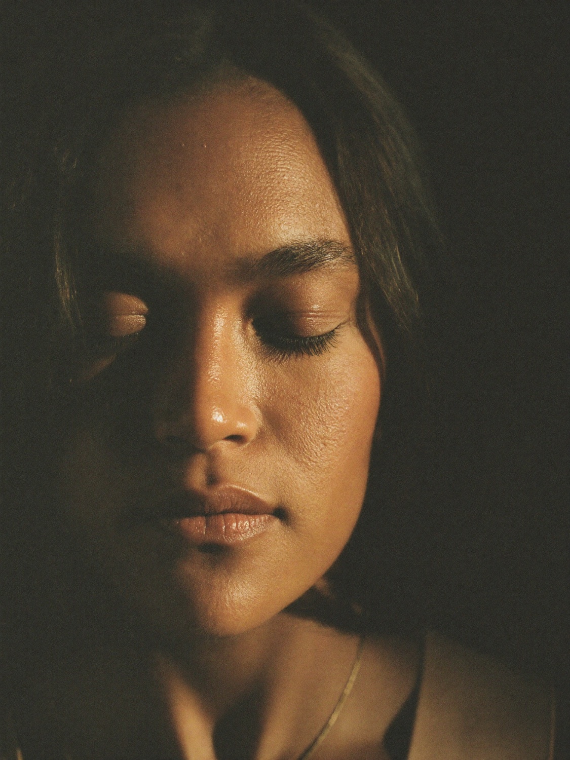 Woman breathing calmly, eyes closed
